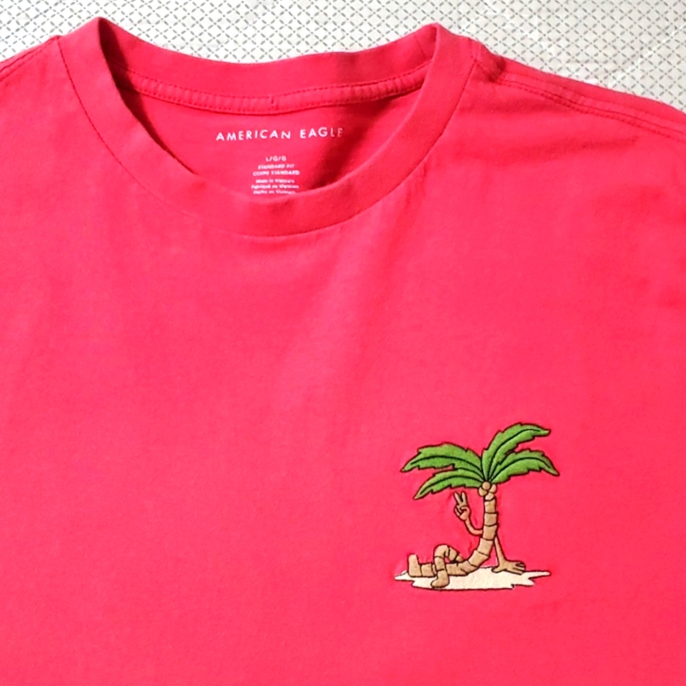 American Eagle T Shirt, size large. Dark Peach color, peace sign palm tree